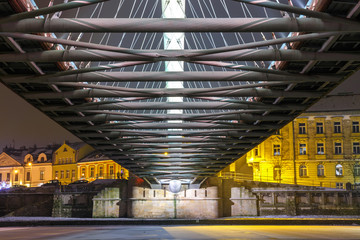 Fototapeta Bernatka footbridge over Vistula river in the night in Krakow, Poland obraz