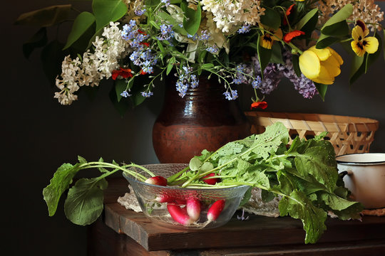 Still life in rustic style with radish and a bouquet