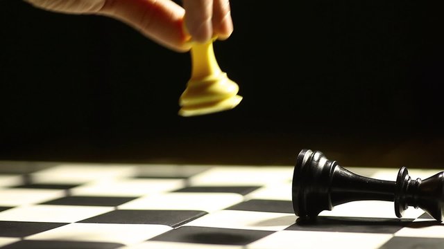 White pawn moves and wins a chess game.