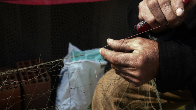 Fisherman Repairs Fishnets Fishing Lines