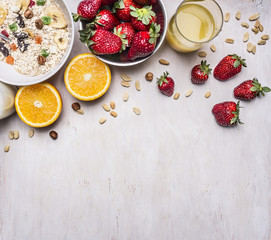 the concept of a healthy and wholesome breakfast, cereal with nuts and fruit place for text,frame on wooden rustic background top view