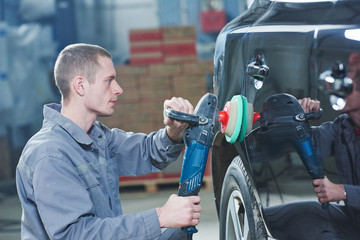 auto mechanic buffing car autobody 