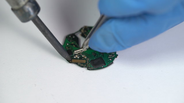 Repair of electronic watches. soldering microchips and circuit boards