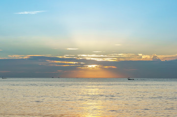 Fototapeta premium Sunset on the beach with beautiful sky in Thailand, Phuket. Boats on horizon.