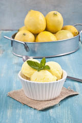 Lemon ice cream cup and lemons.