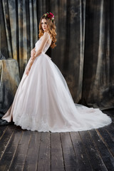 pretty bride in wedding dress and flowers in hair
