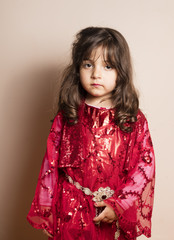 Kurdish girl in red classic kurdish dress in Iraq