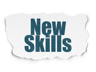 Education concept: New Skills on Torn Paper background