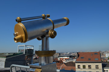 Touristic telescope with rooftop view of Brussels in the Minims street