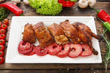 Roasted duck with apples and vegetables.