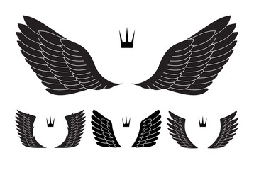Set of four pairs of wings with crowns. Vector illustration.