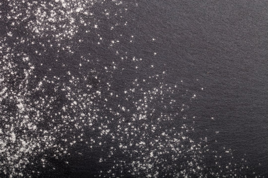 Flour Spilling On Color Background Of Slate Cutting Board