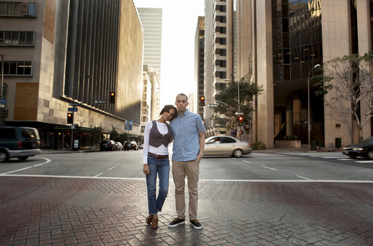 Couple standing on city street