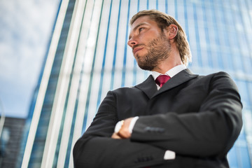 Businessman in front of his office building