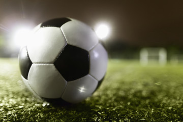Fototapeta na wymiar Soccer ball on sports field