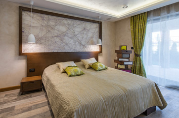 Double bed in bedroom interior