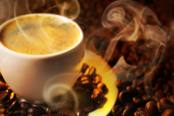 Cup of coffee and grains, closeup