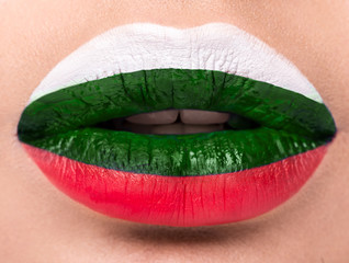 Female lips close up with a picture flag of Bulgaria. white, green, red.