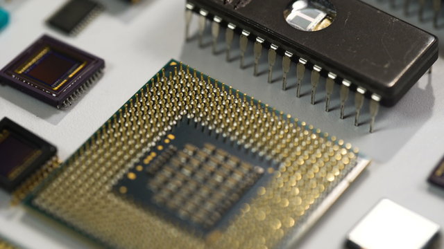 computer processor and electronic components on white background