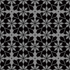 Fototapeta premium Elegant dark antique background image of star flower kaleidoscope