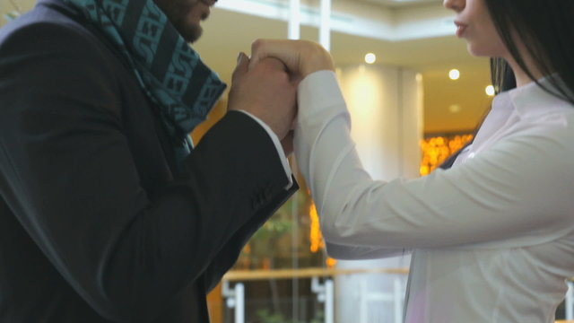 Man kissing the hands of his girlfriend