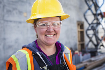 Caucasian worker wearing safety goggles on site