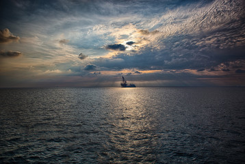 Crane barge in the sunset © kithanlea