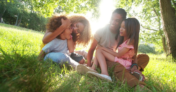 Cute brother and sister spends time with their parents.