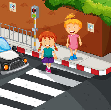 Two girls crossing the road