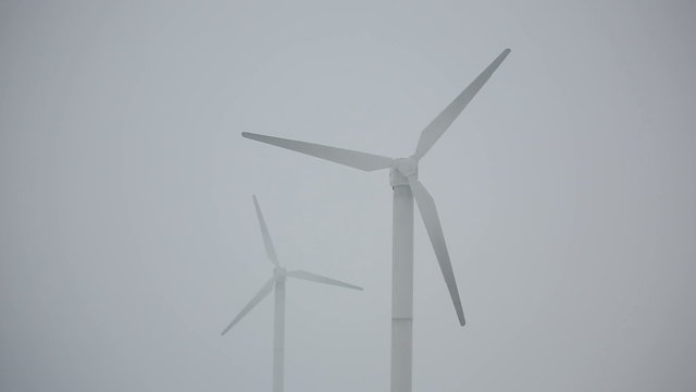 Several wind turbines in winter time