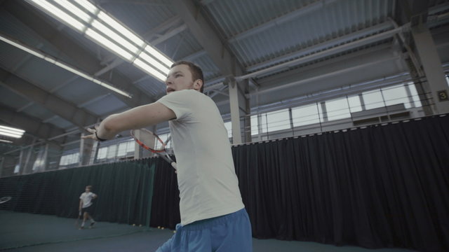 Handsome man playing tennis