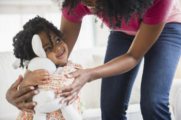 Girl hugging stuffed animal