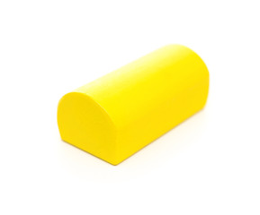 piece of yellow wooden toy block on white background