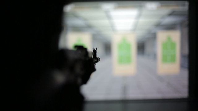 Firearms practice: Man is shooting from weapon AK-47