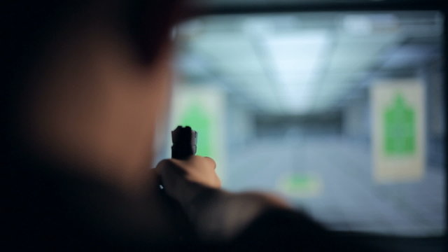 Firearms practice: Man is shooting from laser gun