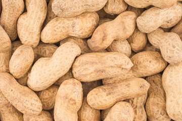 Many peanuts in shells, one upon the other
