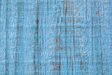 Grungy wood planks with blue peeling paint