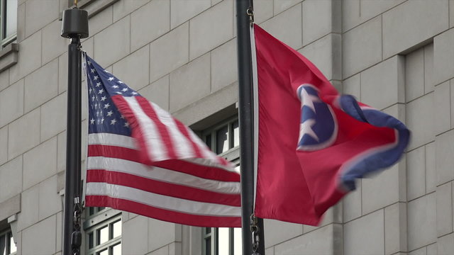 US and Tennessee flags blow in the wind, USA
