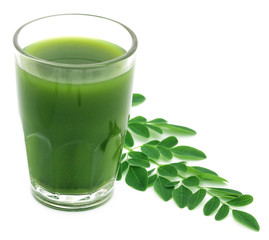 Moringa leaves with juice in a glass