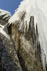 Huge icicles on rocks.