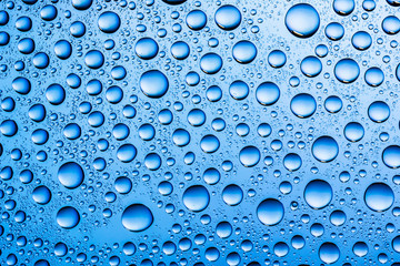Water drops on glass surface texture.
