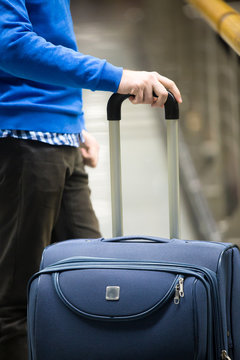 Traveler with suitcase