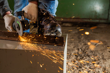 Worker working of a grinding machine