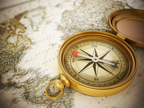 Fototapeta Vintage compass standing on old map