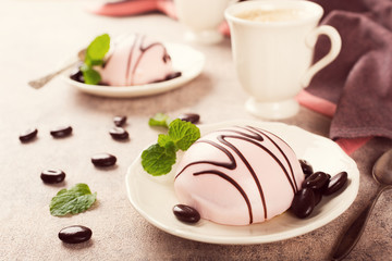 Mousse cakes covered with pink glaze 