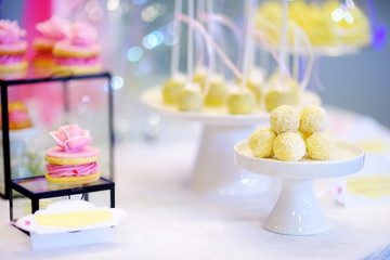 Beautiful desserts, sweets and candy table at wedding reception