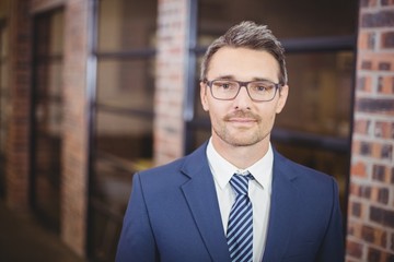 Fototapeta premium Confident businessman standing in office