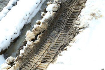 Tracks in snow. Car mud footprint