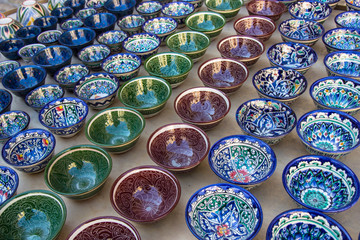 Rows of uzbek cups with traditional uzbekistan ornament, Bukhara