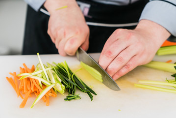 chef cutting vegetables